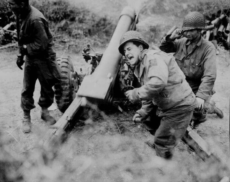 American howitzers shell German forces retreating near Carentan