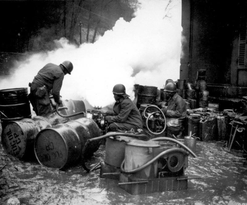 161 Chemical Smoke Generating Company refilling a M-2 smoke generator