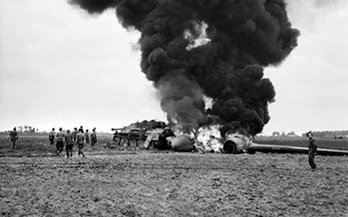1 Airlanding Recc Sqdn on the ground gathering their parachutes