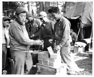 Japanese-American soldier of the 100 Infantry Battalion hanging his laundry