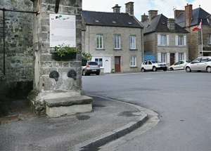 American soldiers stand at the village fountain, Sainte-Marie-du-Mont