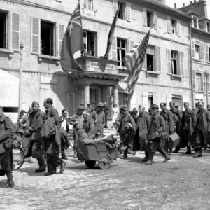 German prisoners file past the Town Hall at Cherbourg