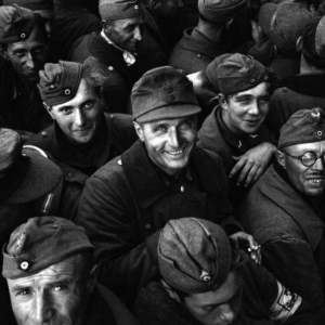 German prisoners file past the Town Hall at Cherbourg